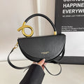 Kleine Schultertasche mit goldfarbenen Details